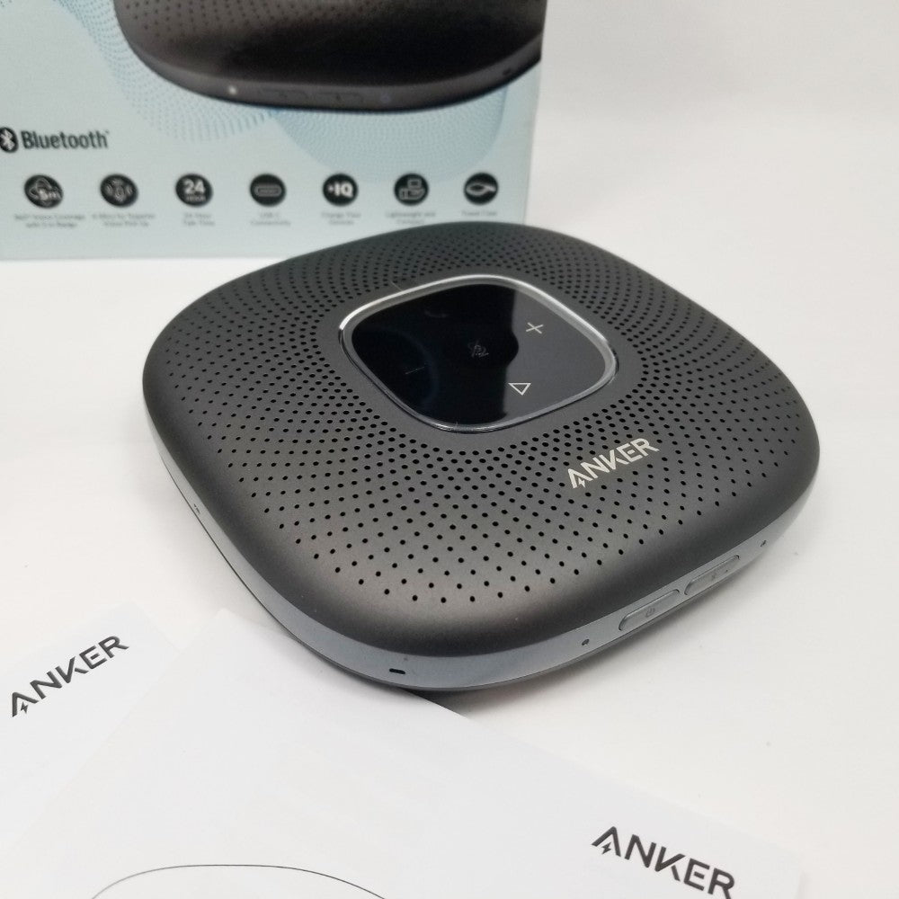 Anker Bluetooth speaker top view on a white backround