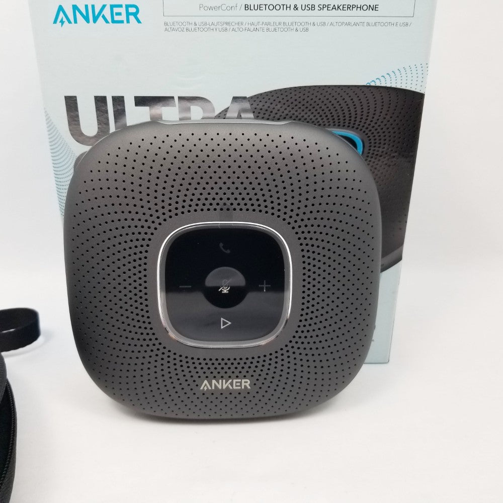 Anker Bluetooth speaker Showing buttons in the background