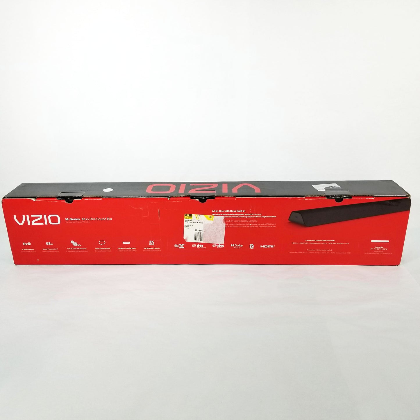 Full length view of retail box on a white surface.