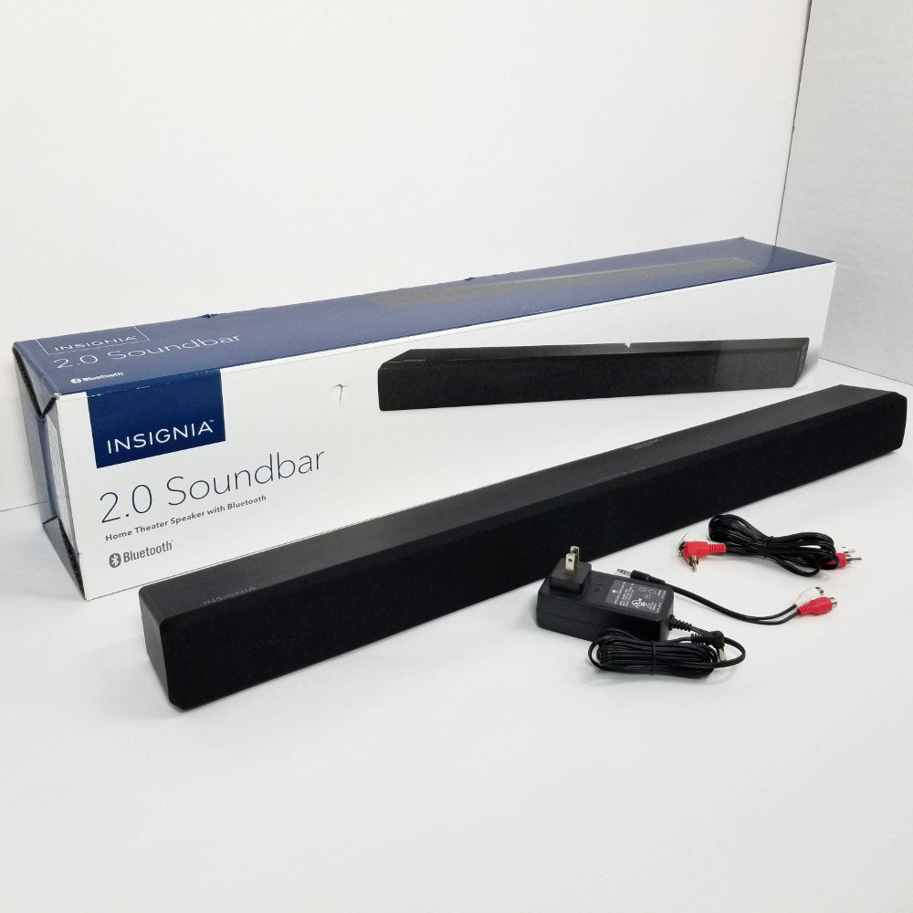 Insignia 2.0 soundbar with power adapter and cables on a white background