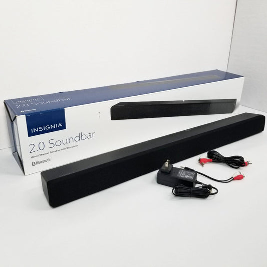 Insignia 2.0 soundbar with power adapter and cables on a white background