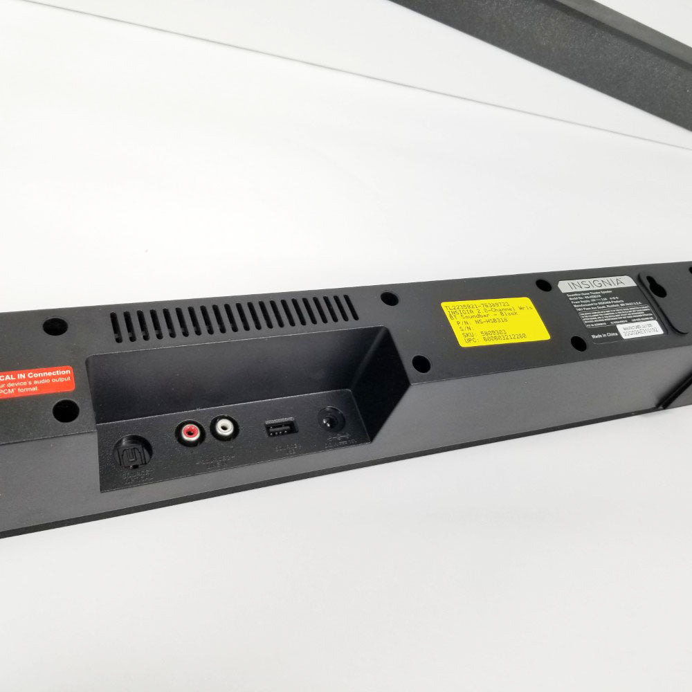 Back view of Insignia 2.0 soundbar with ports and labels on a white background