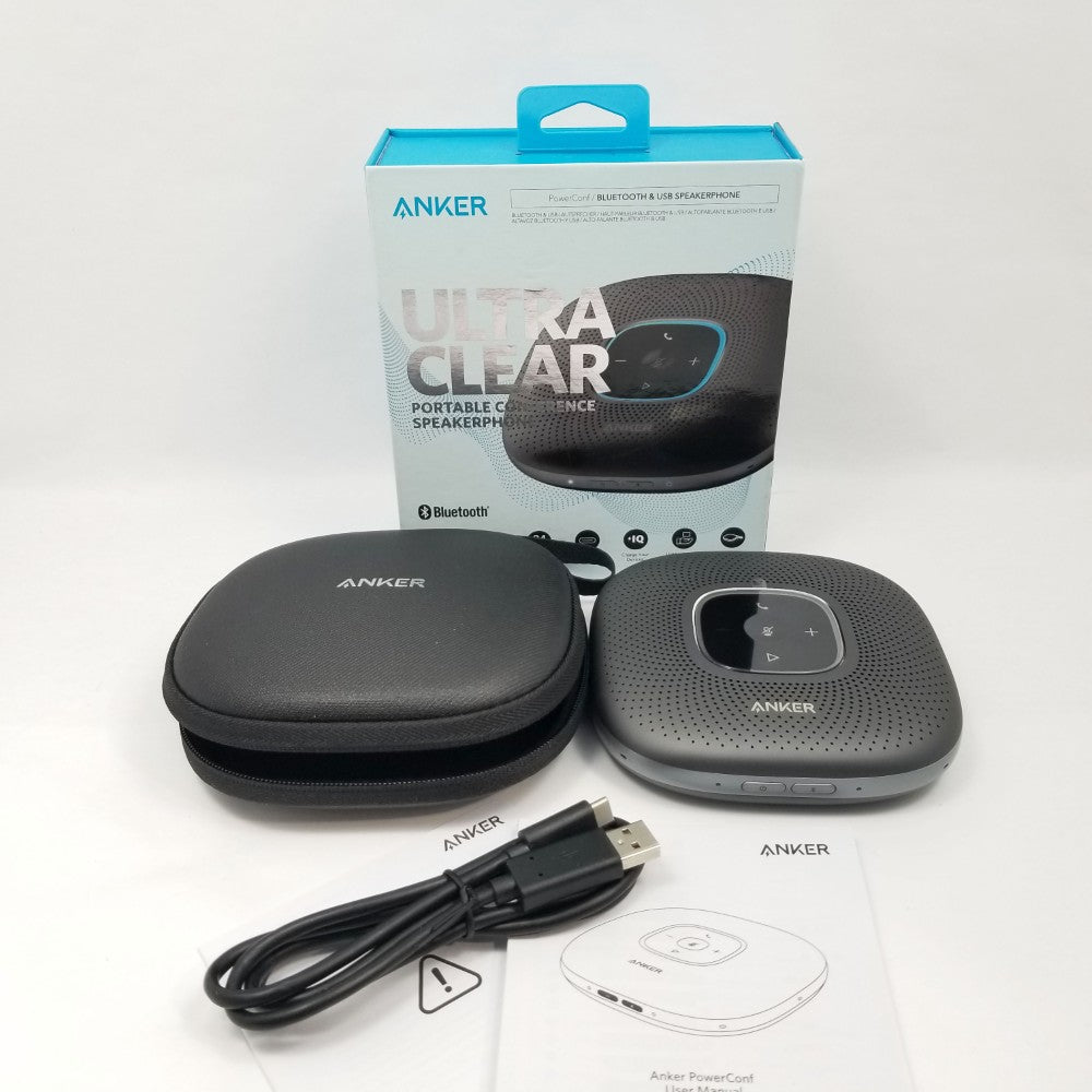 Anker portable conference speaker with carrying case, USB cable, and packaging on a white background