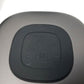 Black wireless charging pad with 'Anker PowerPort' branding on a gray background