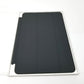 Black Apple Smart Cover for iPad mini 4th & 5th Gen in retail packaging lying flat on white surface.