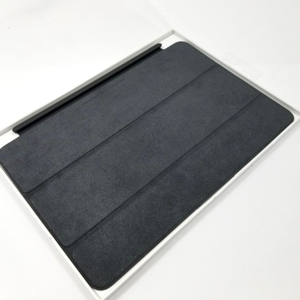 Showing inner fabric surface of Black Apple Smart Cover for iPad mini 4th & 5th Gen lying flat on white surface.