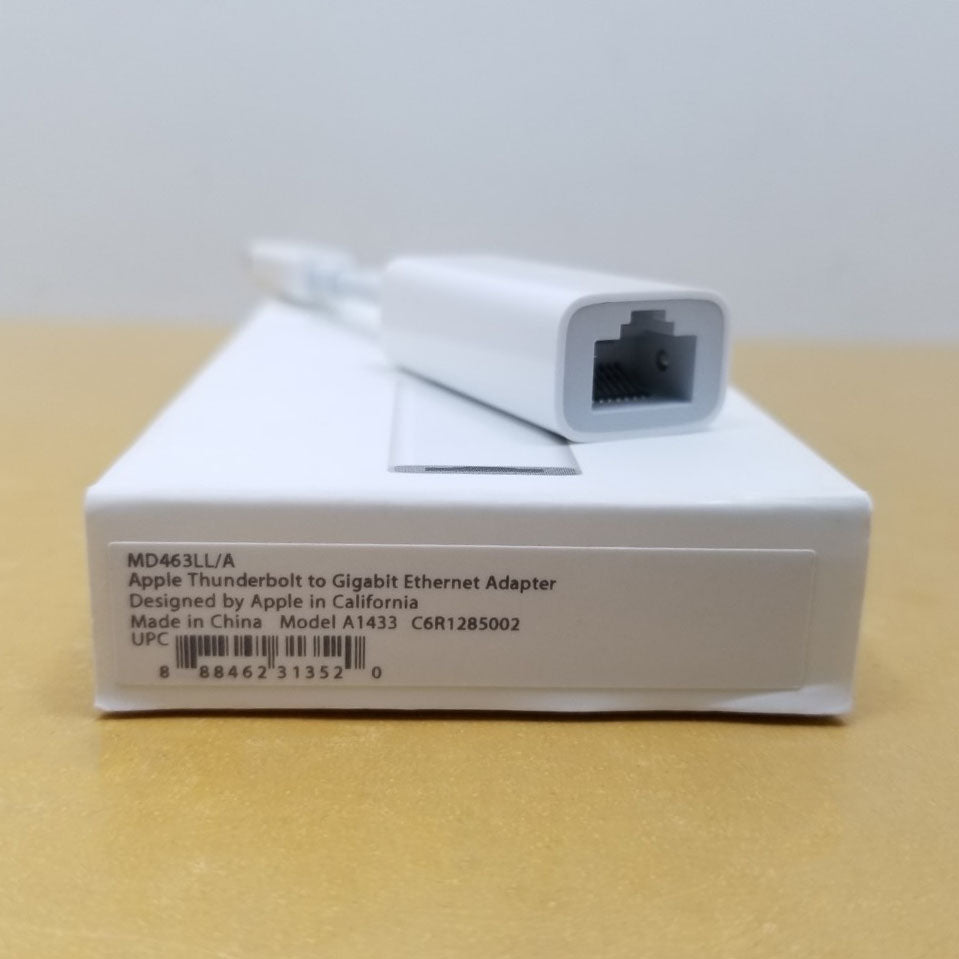 Close up of Ethernet port on adapter and retail packaging showing manufacturer part number.