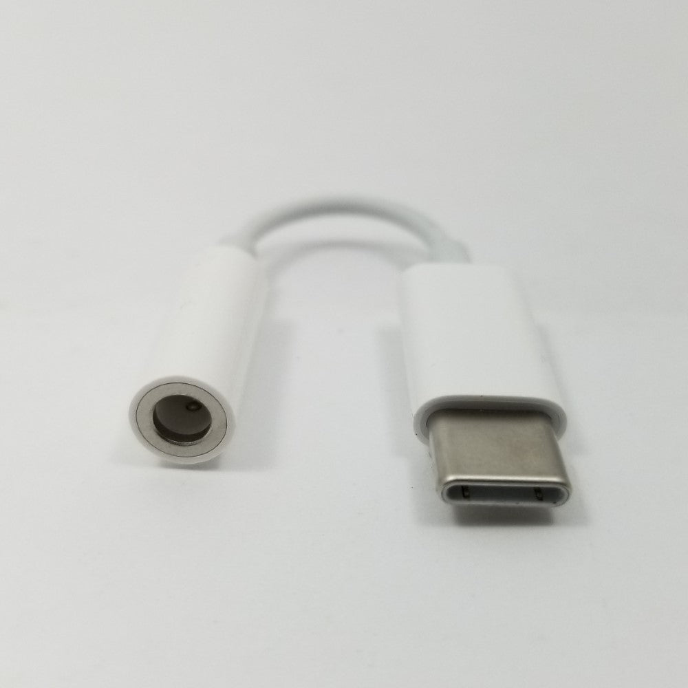 Pictured on a white surface are both female and male ends of USB-C to 3.5mm jack adapter