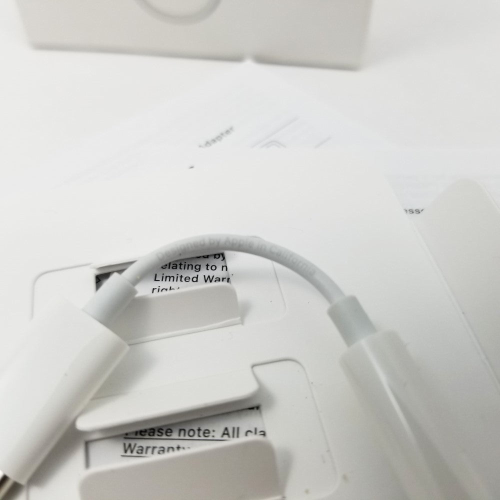 Manufacturer inscription  shown on adapter cable sitting on a white surface