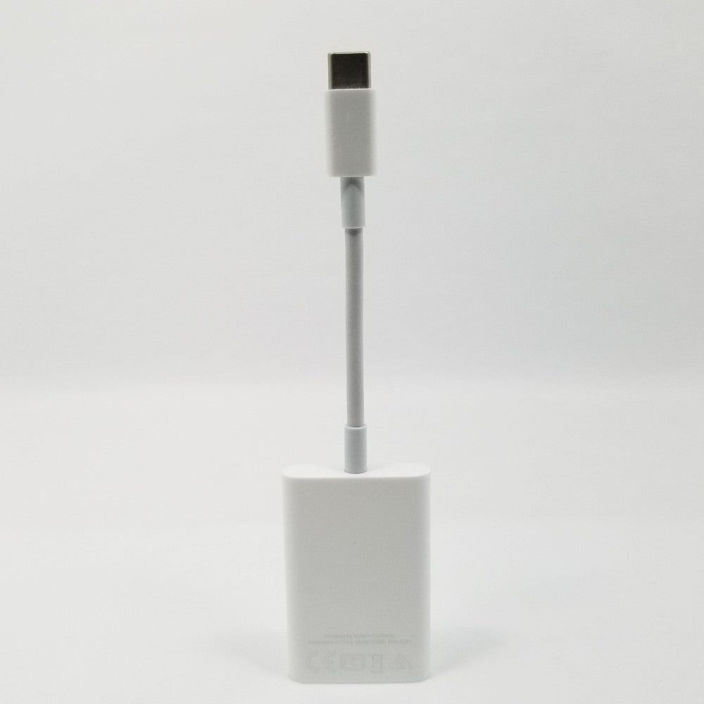 USB-C to SD card adapter standing upright against a white background.