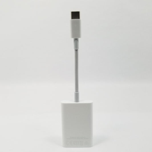 USB-C to SD card adapter standing upright against a white background.