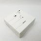 Retail packaging for Apple earpods sitting on a white surface.