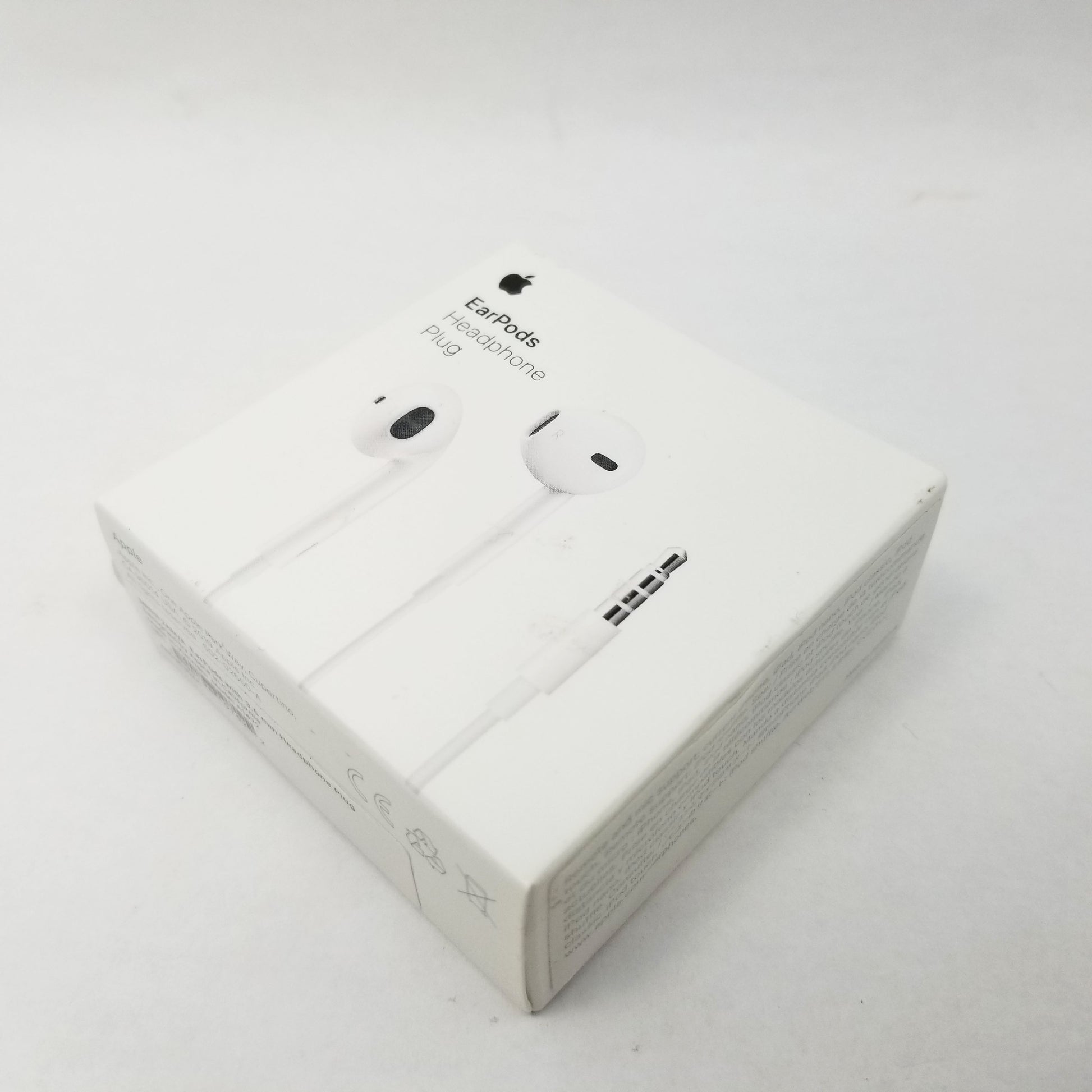 Retail packaging for Apple earpods sitting on a white surface.