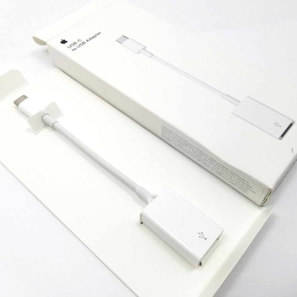 Apple USB-C to USB-A adapter cable in white color, displayed in its packaging on a white background.