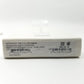 Close up of manufacturer label with inscriptions on bottom edge of packaging.