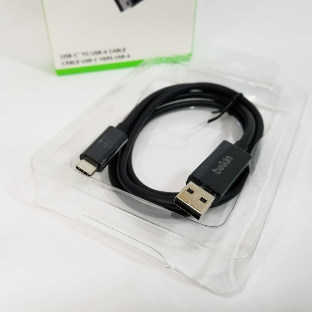 USB cable with Belkin logo on a clear plastic stand against a white background