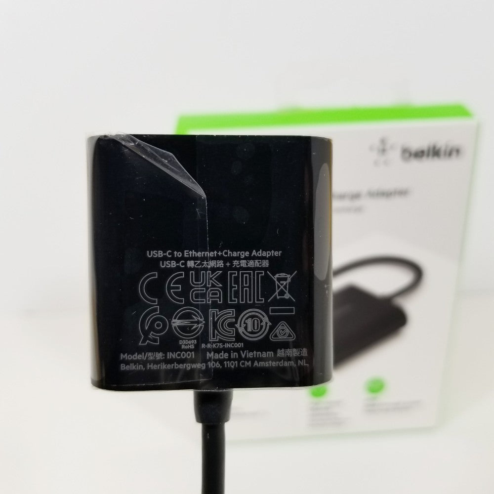 Black USB-C to Ethernet + Charge Adapter with visible branding on a white background