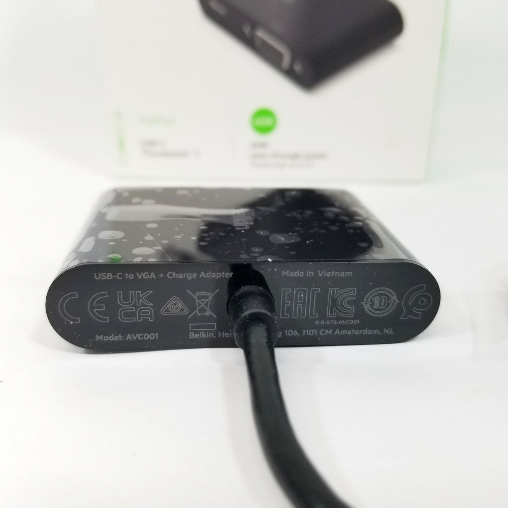 Manufacturer labeling on VGA adapter against a white background.