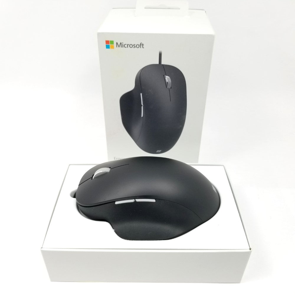 Microsoft wired ergonomic mouse sitting inside open packaging against a white background.
