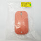 Top view of Peach Microsoft mobile mouse showing logo and scroll wheel.