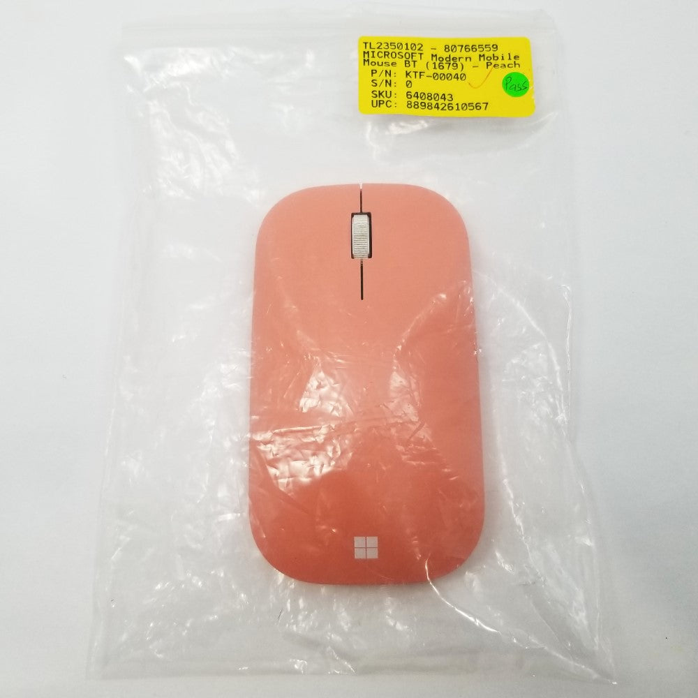 Top view of Peach Microsoft mobile mouse showing logo and scroll wheel.