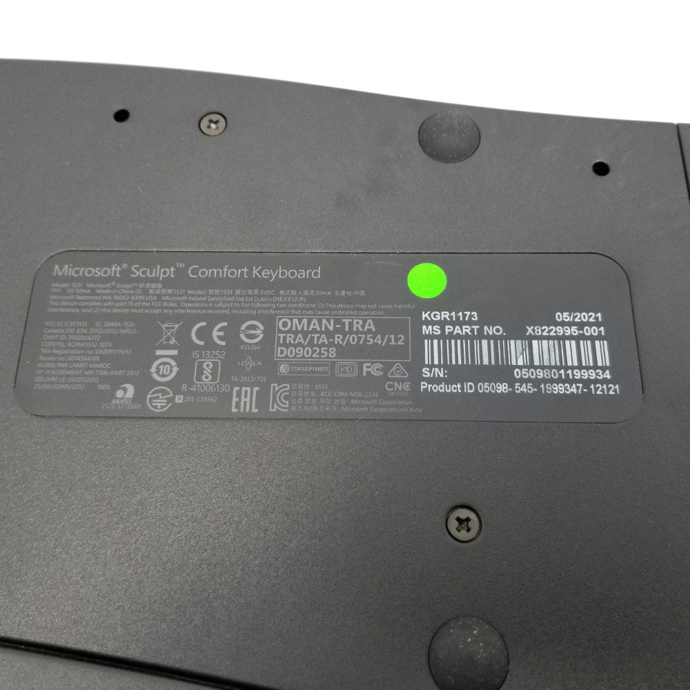 Back view of a Microsoft Sculpt Comfort Keyboard with part number label and product details.