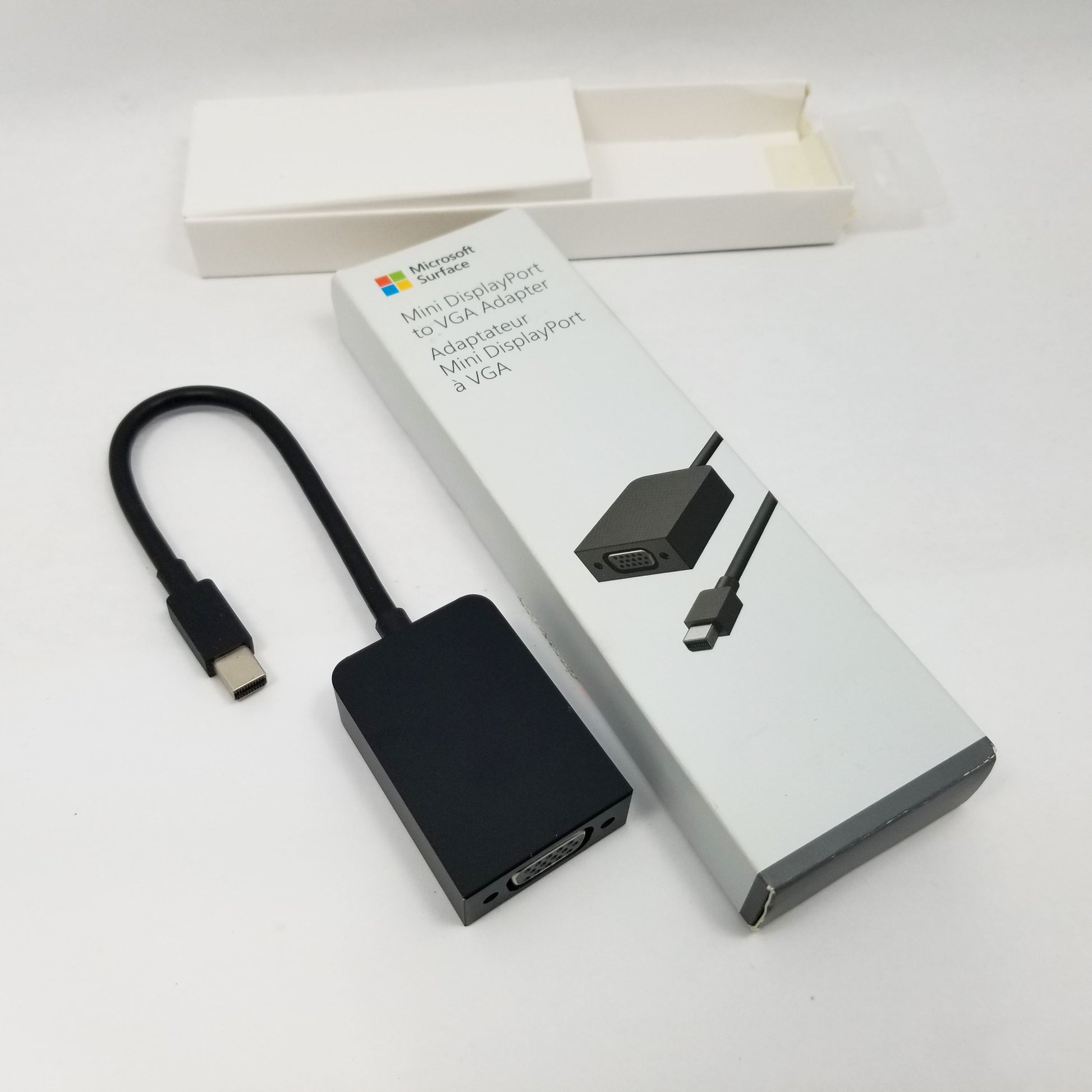 Microsoft DisplayPort to VGA adapter with packaging on a white background