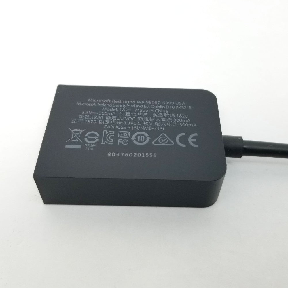 Minidisplay to VGA adapter showing certification logos on back side on a white background