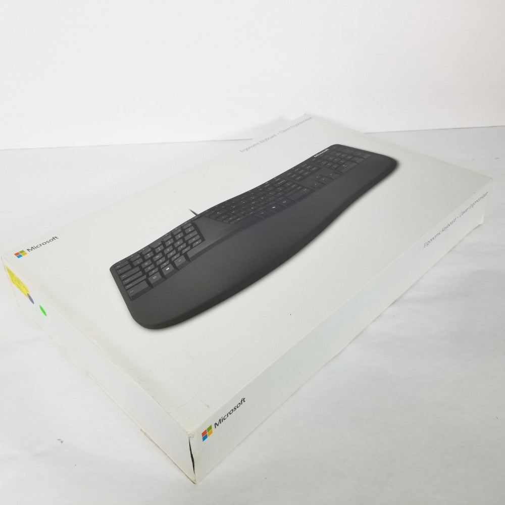 MICROSOFT Wired Ergonomic Keyboard top view retail packaging against white background