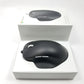 Microsoft wired ergonomic mouse sitting in open retail packaging against a white background,