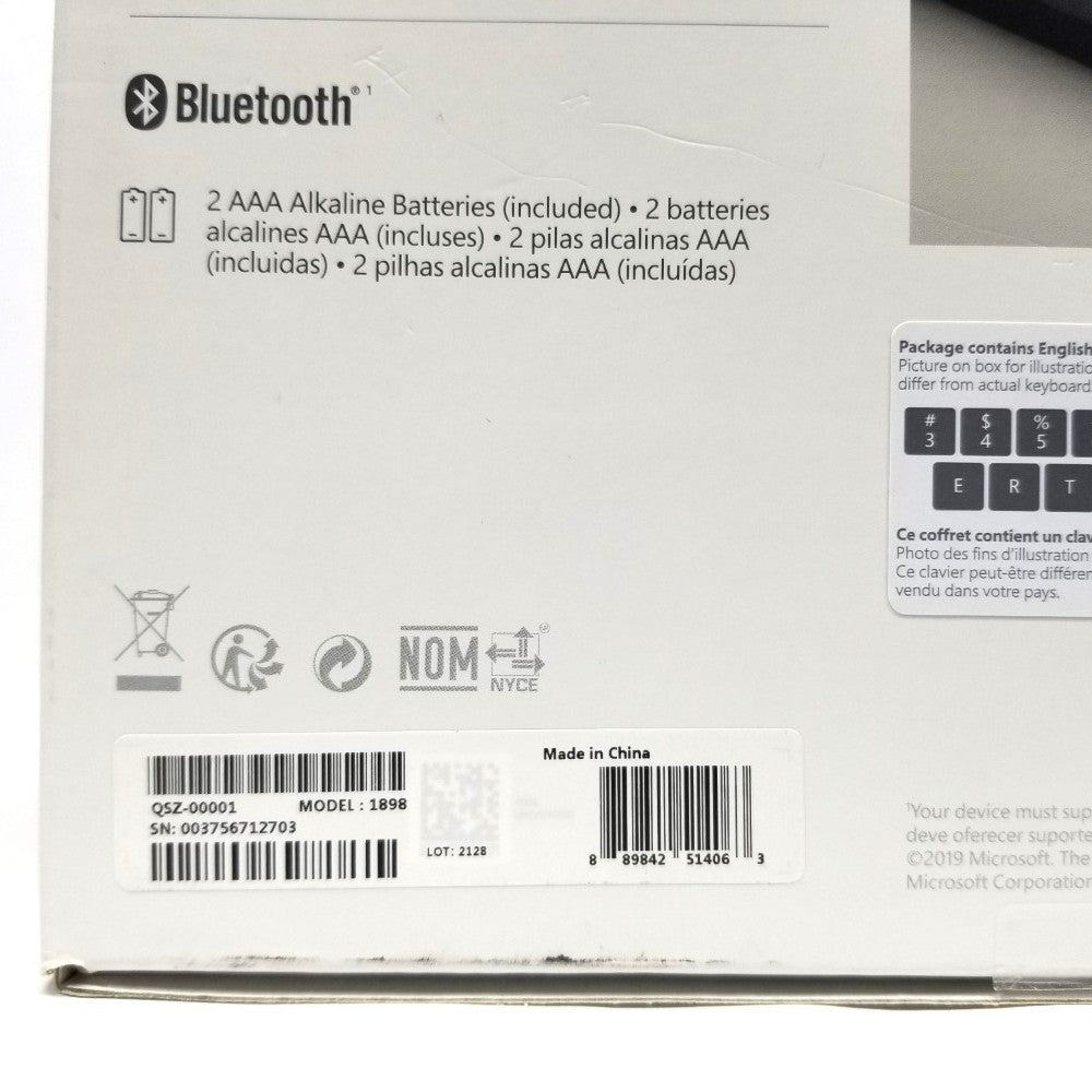 Back view of packaging for Microsoft Bluetooth Keyboard QSZ-00001 with manufacturer identifier numbers.