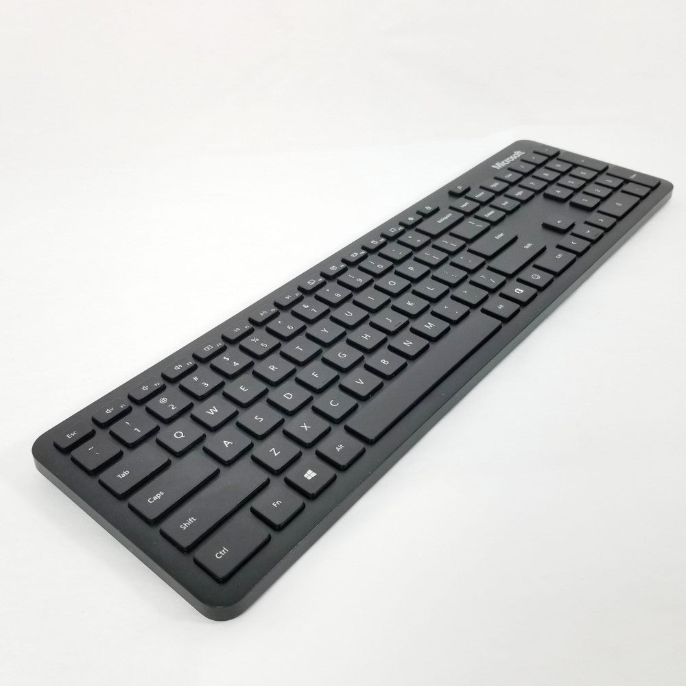 Diagonal view Black Microsoft Wireless Bluetooth keyboard QSZ-00001 on a white background