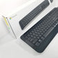 Black Microsoft wireless desktop 850 Keyboard next to retail packaging against a white background.