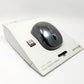 Top side angled view of packaging showing mouse and transmitter on a white background.