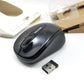 Top side angled view of mouse and transmitter on white surface.