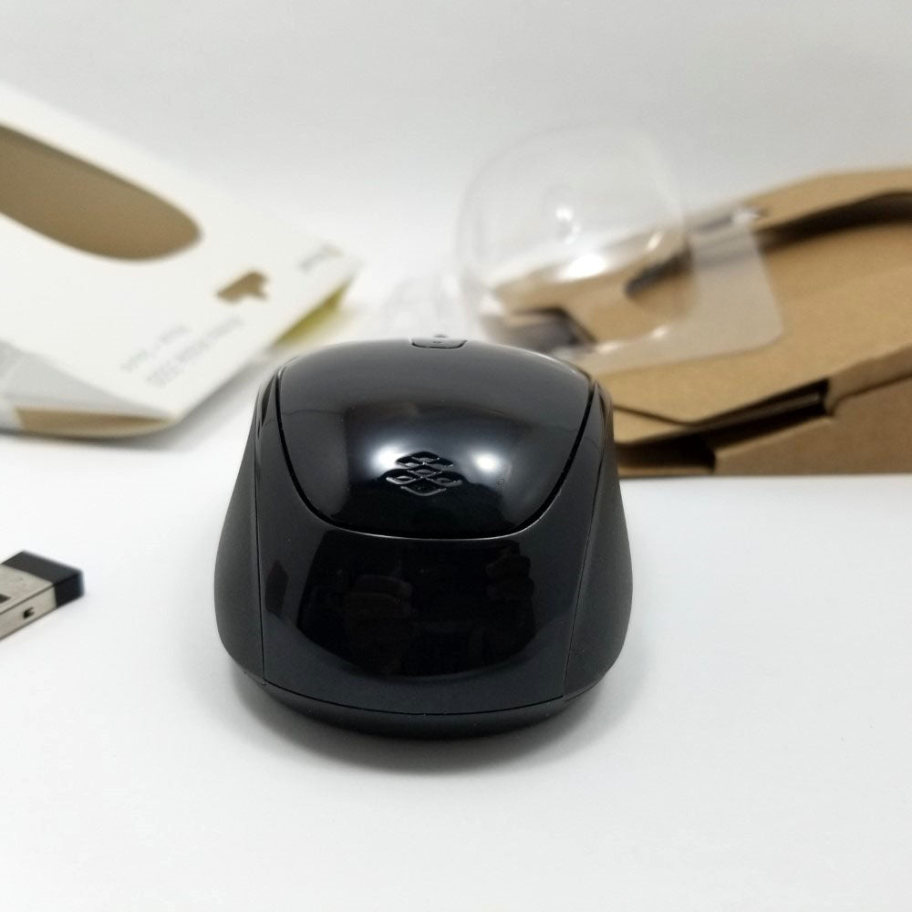 Back view of mouse on white surface.