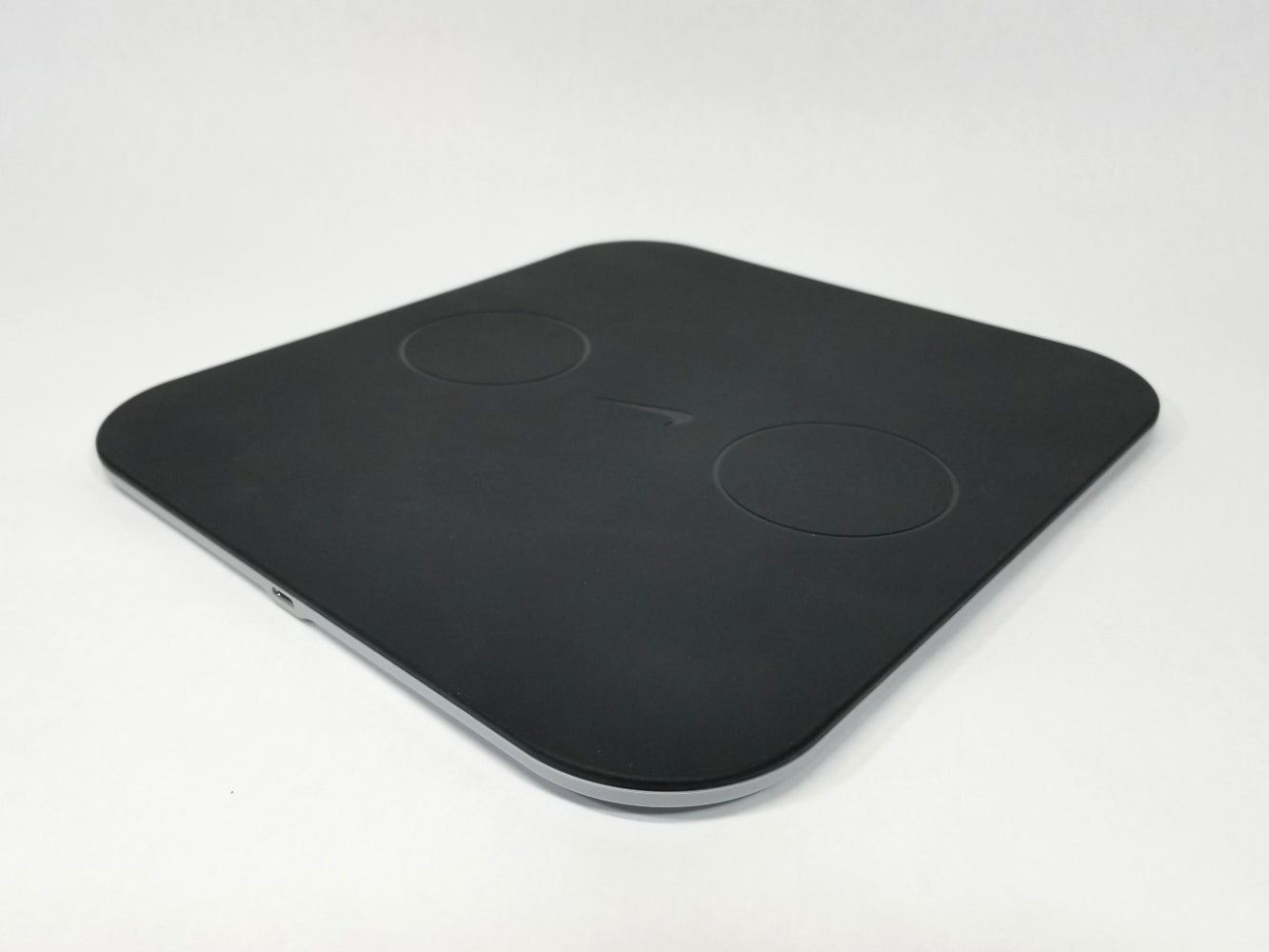 Top angled shot of Nike Adapt Charging Mat on a whit surface.