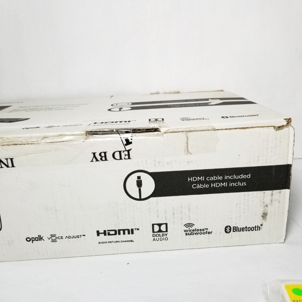 Product packaging showing "polk, HDMI, Dolby audio, wireless subwoofer and Bluetooth"