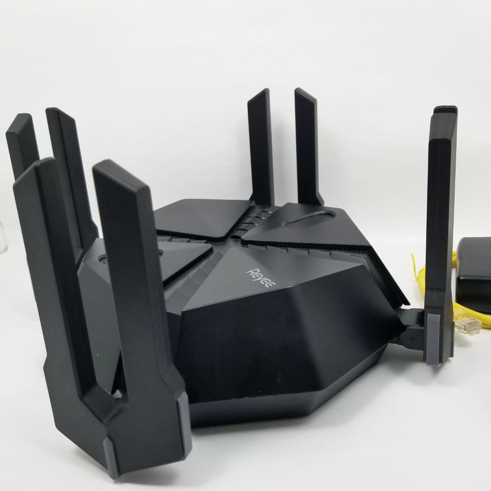 Black router with multiple antennas on a white background
