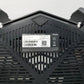 Black router showing bottom with part number label on a white background