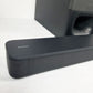 Sony soundbar on a white background. Subwoofer partially visible in the background