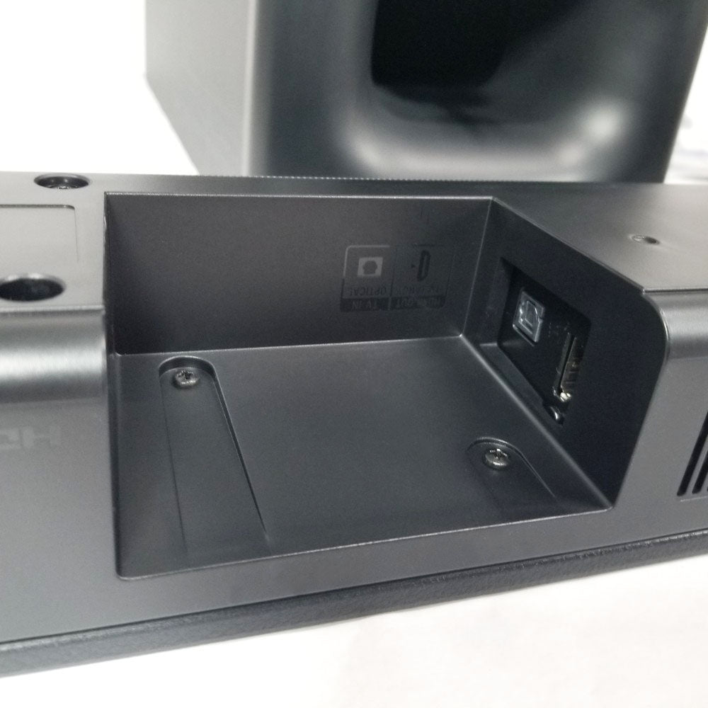 Close-up of rear ports and connectors of Sony soundbar on a white background