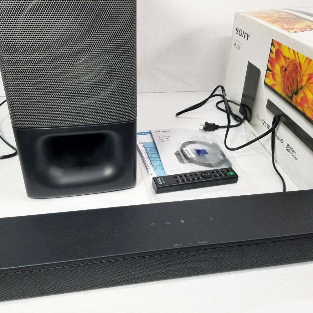 Sony soundbar and subwoofer with remote control, user guides and retail box on a white surface