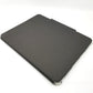Black UAG lucent case lying diagonally on a white surface.
