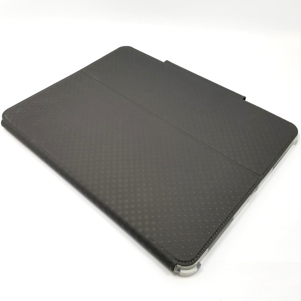 Black UAG lucent case lying diagonally on a white surface.