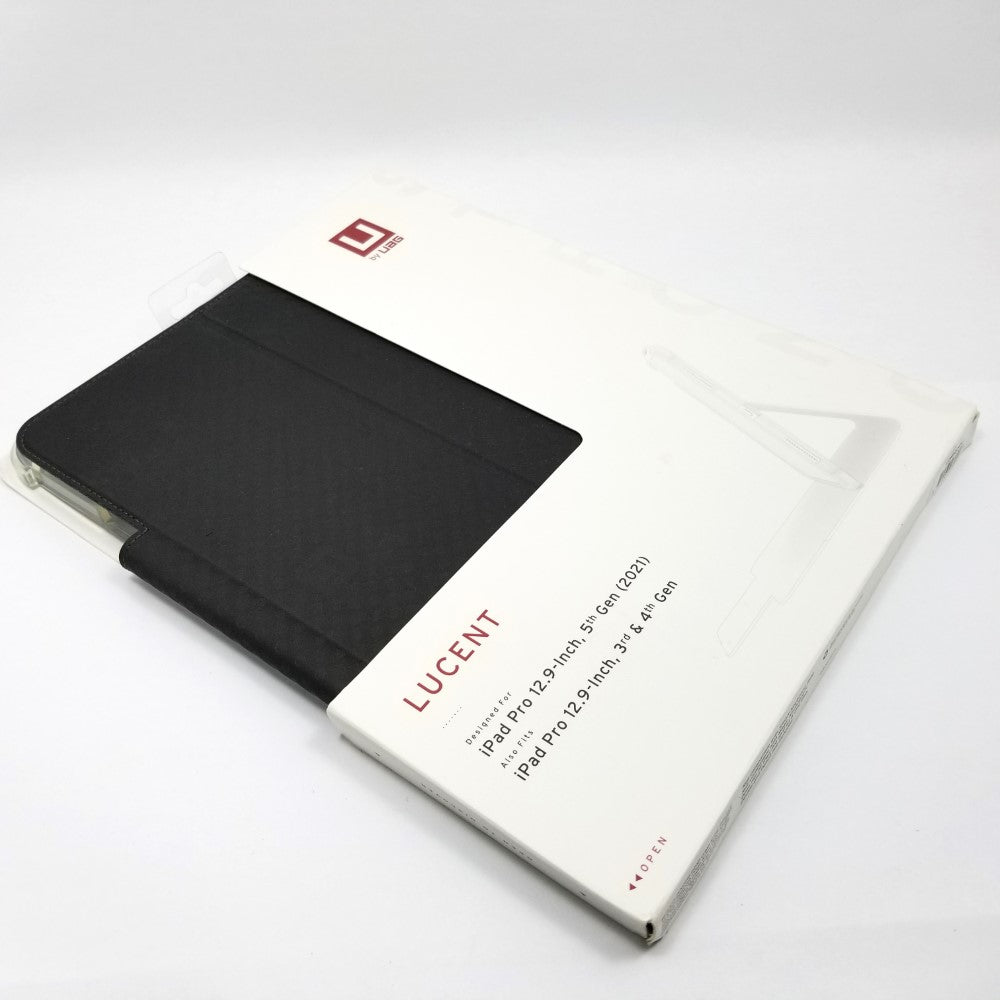 UAG Lucent case in retail packaging lying diagonally on a white surface.